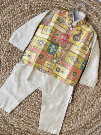 Yellow green printed koti with cream kurta pyjama